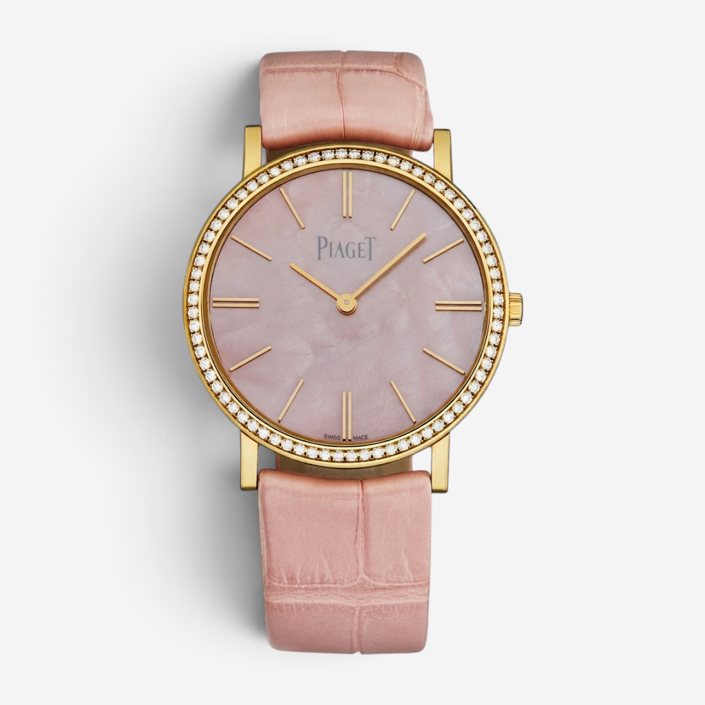 THE SOLIST Piaget Altiplano rose gold watch with diamond bezel, pink mother-of-pearl dial, and pink alligator strap.