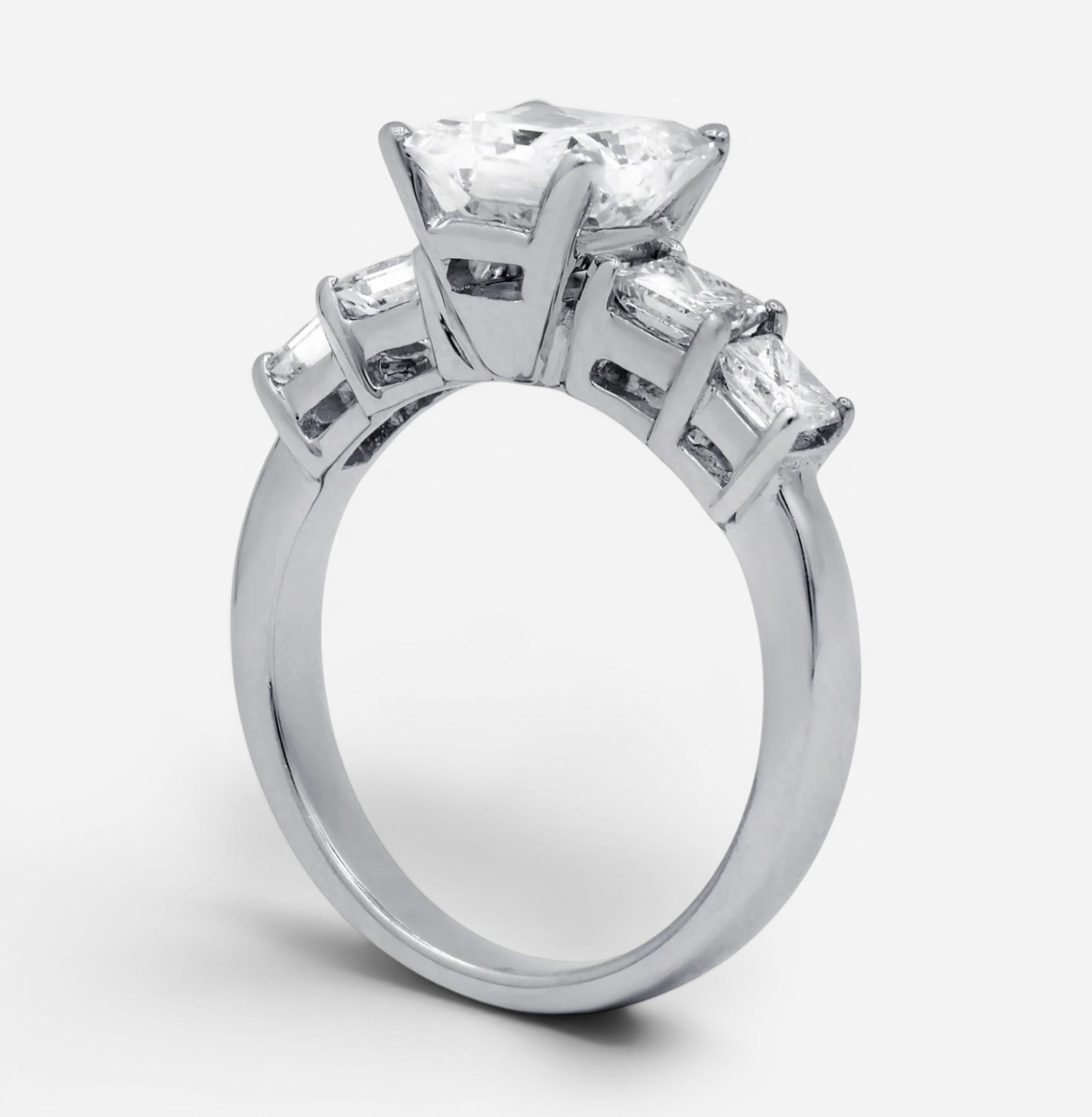 THE SOLIST 18K white gold engagement ring featuring a 2.01-carat radiant-cut diamond and side accent stones.