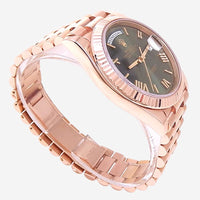 THE SOLIST Rolex Day-Date 40 automatic men's watch in 18k Everose gold with green dial, Roman numerals, day and date display.