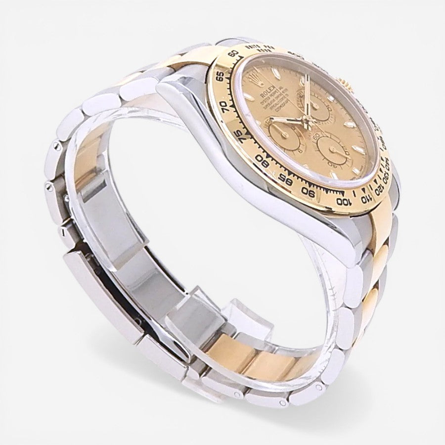THE SOLIST Rolex Daytona men's watch with champagne dial, stainless steel and 18k gold two-tone bracelet and bezel. Features automatic movement and chronograph.