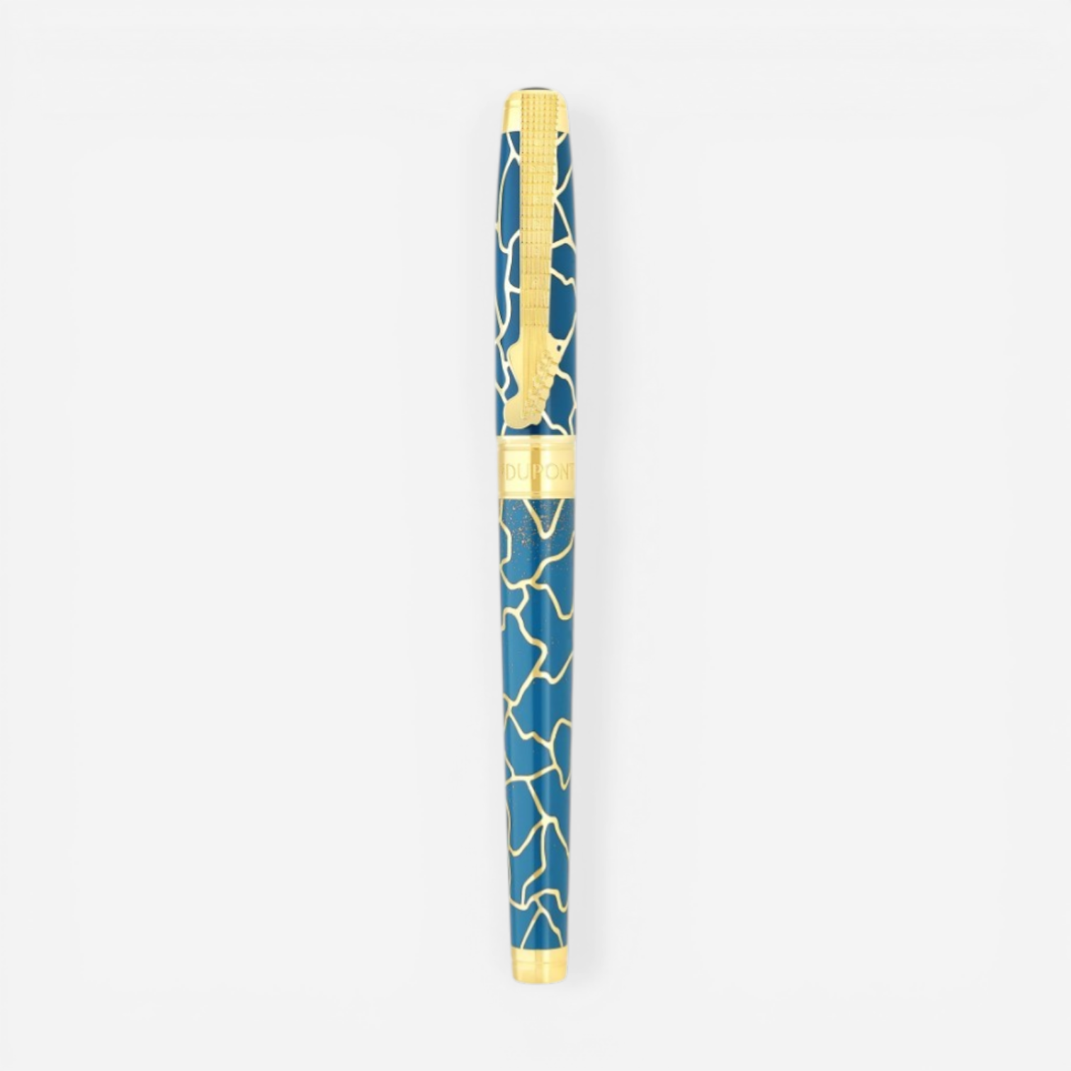 THE SOLIST S.T. Dupont x Fender blue brass rollerball pen with gold accents and intricate pattern.