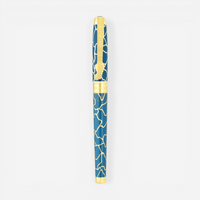 THE SOLIST S.T. Dupont x Fender blue brass rollerball pen with gold accents and intricate pattern.